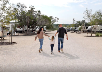 Sunset Ranch RV Park Leander, Texas - Family walking in the Park