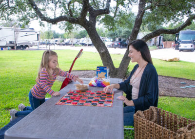 Sunset Ranch RV Park - Mother and Daughter Playing Checkers