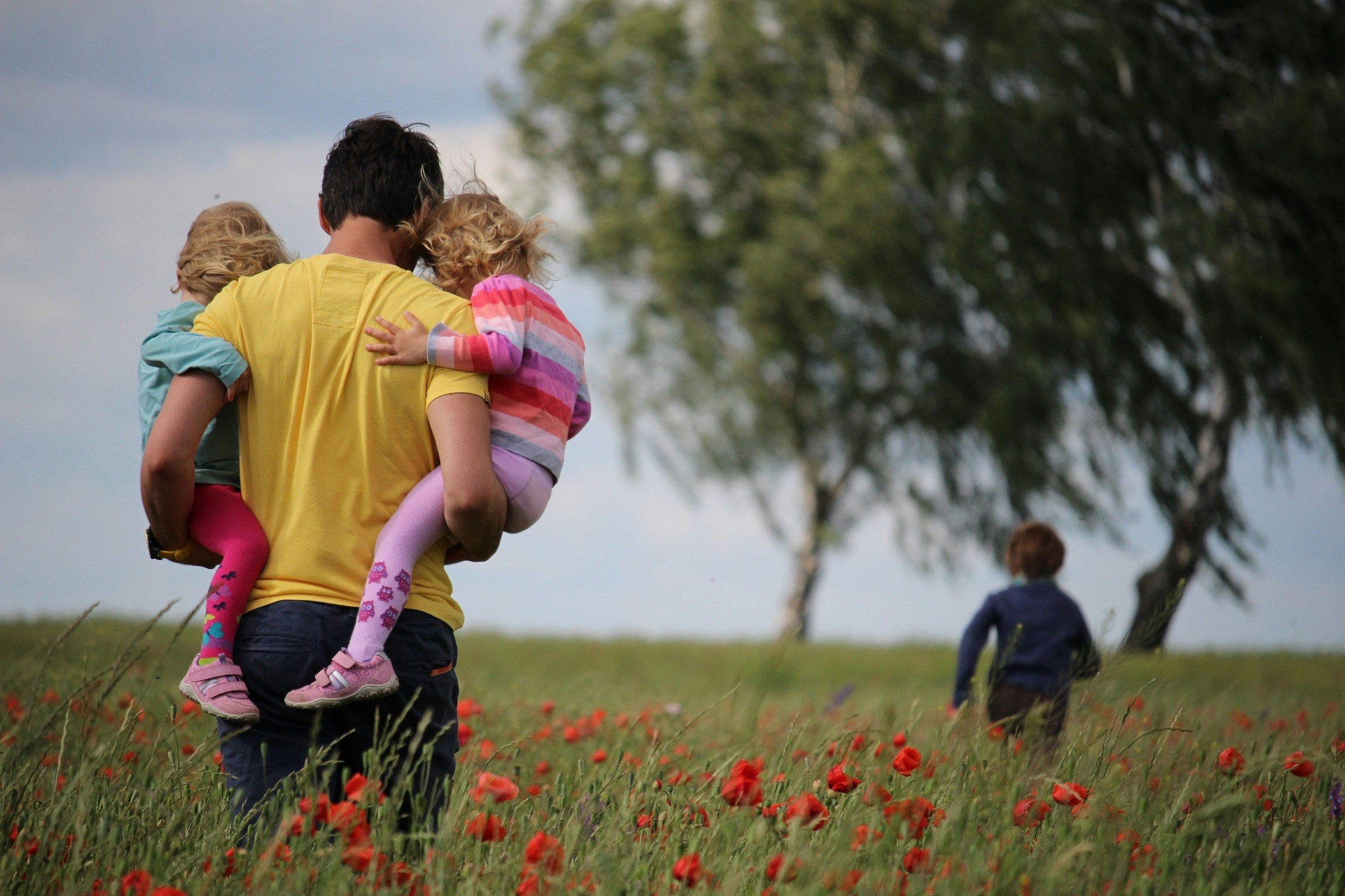 A family walks through Texas Hill Country to their RV campground